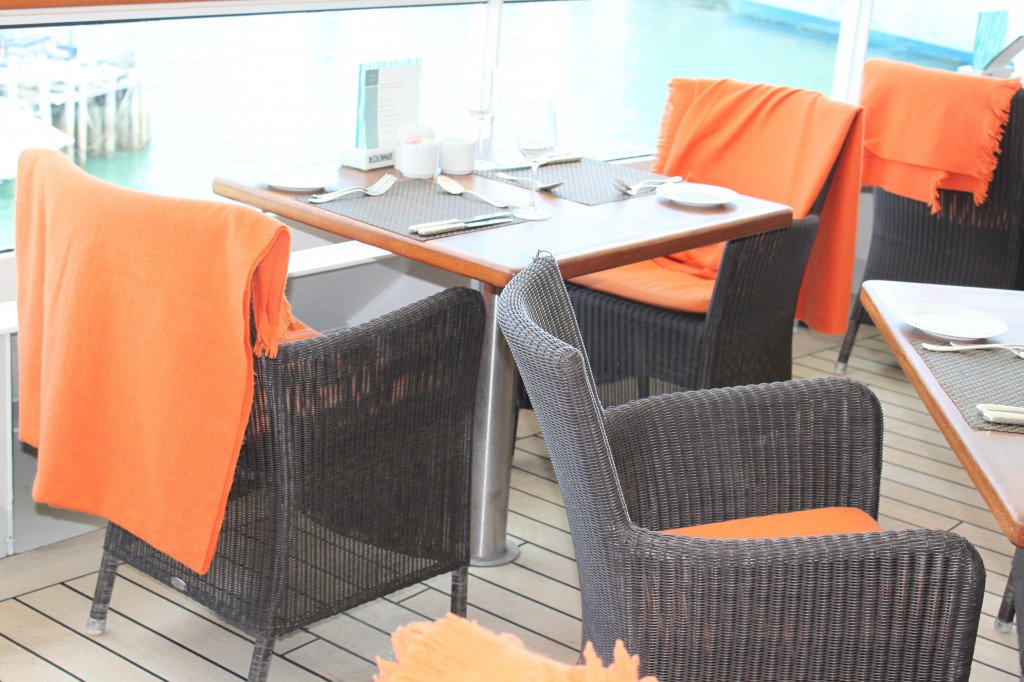 Outside dining with stunning orange wool wraps